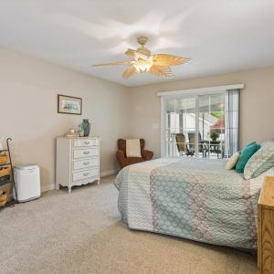 Primary Bedroom with direct access to screened porch