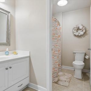 Hall Full Bath with separate private tub and toilet room.