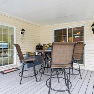 Screened Porch w/composite decking and sliding glass doors to the sunroom as well as the primary bedroom.