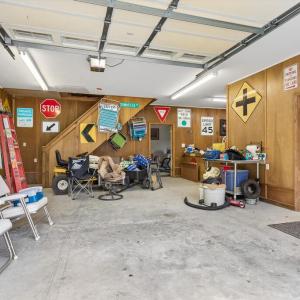 Detached garage with finished office space, workshop, and large back room with a sink.