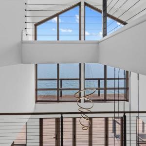 Dramatic 2 Story Windows with Water Views