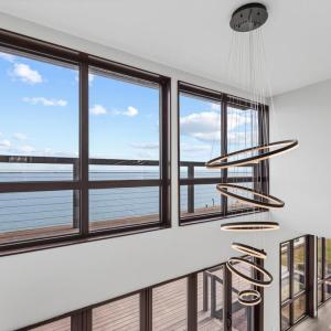 Dramatic 2 Story Windows with Water Views