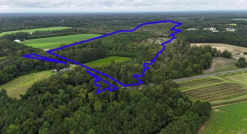 View of rural area featuring a heavily wooded area