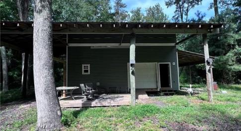 Two story barn with great deck upstairs.