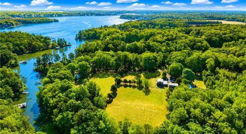 Overview of land with water frontage through small tree line