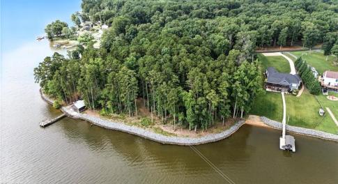 Waterfront lot begins just to the left of the home on the right.