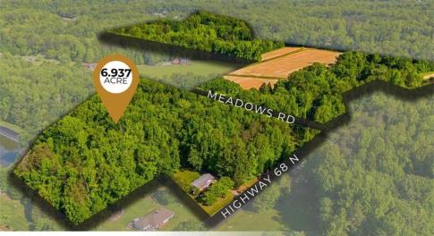 Prime dual-frontage opportunity! This 6.937-acre tract offers multiple access points and unbeatable positioning just a stone's throw from the Oak Ridge Town Park.
