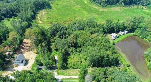 2.5 acres (lot sits between new construction residence to the left and lake-side residence to the right)