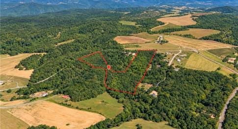 20.65 Acres Wooded Land for Sale Orange County NC. Aerial view of about 20.65 wooded acres for sale in Orange County, NC, between Chapel Hill and Mebane near Saxapahaw. Creekfront land on a paved road for a country home, mini farm or homestead. Boundary approximate.