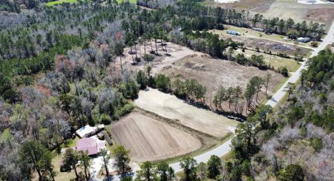 Birds eye view of property with a rural view