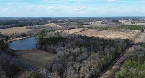 Aerial view featuring a water view and a rural vie