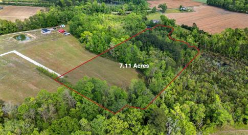 Birds eye view of property with a rural view and a