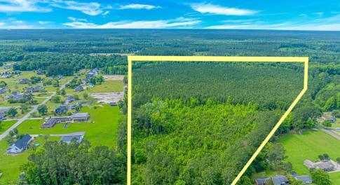 Aerial view of property's location with a heavily