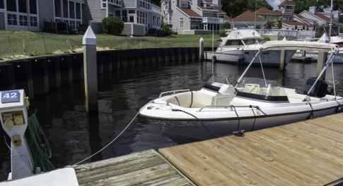 Dock area with a water view and a residential view