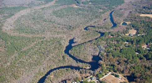 Aerial view of property and surrounding area with
