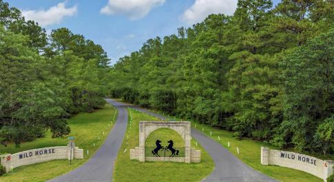 View of property's community featuring a yard and