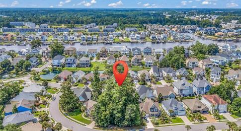 Aerial view of residential area with a large body