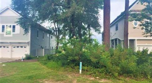 View of property exterior featuring a garage