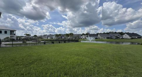 View of grassy yard featuring a residential view a
