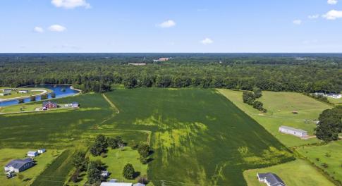 Aerial view of property and surrounding area with