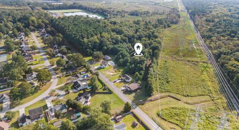 Aerial view of property and surrounding area featu