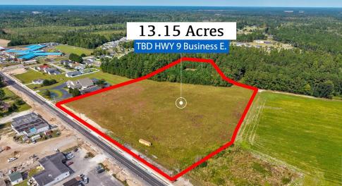 Aerial view of property and surrounding area with