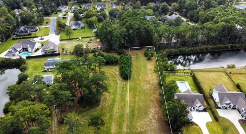 Aerial view of residential area with a large body