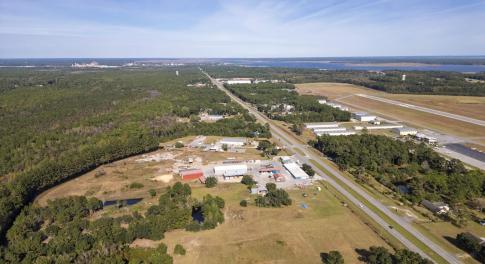 Aerial view of property and surrounding area with
