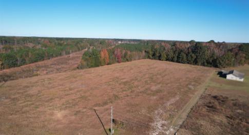 Aerial view of property and surrounding area with