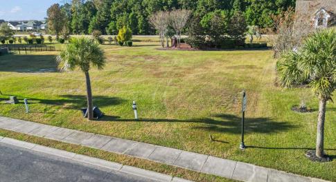 View of home's community featuring a lawn