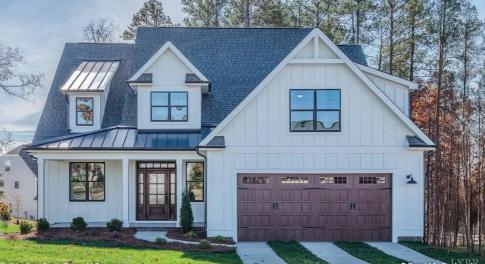 Photo is a rendering of house plan. Finishes will vary and are to be made at builder's discretion. Please reach out for confirmation of exact finishes throughout home. Plans for brick and wood board and batten on exterior.